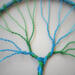 blue and green wire is delicately curved and twisted creating a balanced look